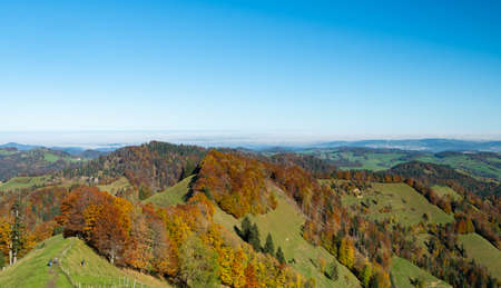 Amazing view from Schnebelhorn, a hill in Cantone Zurich, over colorful autumnal forestsの写真素材