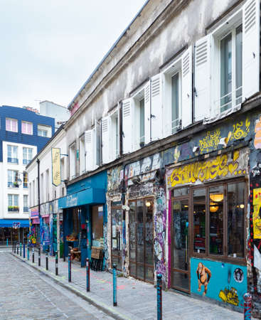 Paris, France - November 14th 2021: Famous streetart and pubs in Rue Denoyez in Eastern Paris.のeditorial素材
