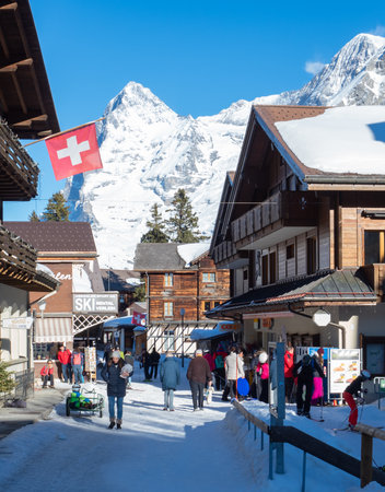 Muerren, Switzerland - February 27th 2022: Busy historic centre of the village in winter