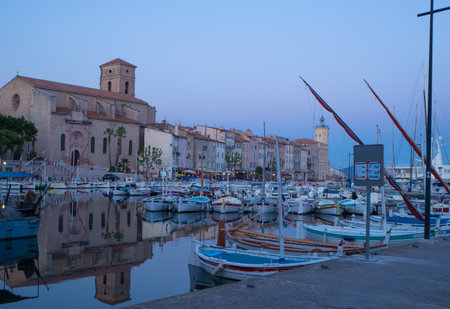 La Ciotat, France - May 17th 2022: Old fishing boats in front of the historic village centre