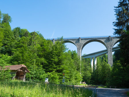 Zug, Switzerland - June 6th 2022: Three generations of bridges spanning over the Lorze valleyの写真素材