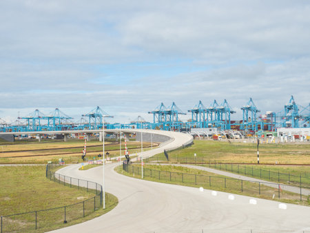 Rotterdam, Netherlands - August 4th 2023: A curvy street leading towards Europoort International Harbourのeditorial素材