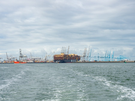 Rotterdam, Netherlands - August 4th 2023: Panoramic view Europoort international harbour with a container shipのeditorial素材