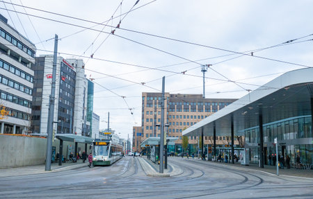 Augsburg, Germany - November 18th 2023: Traffic sitatuation with a tramcar at recently renovated Koenigsplatzのeditorial素材