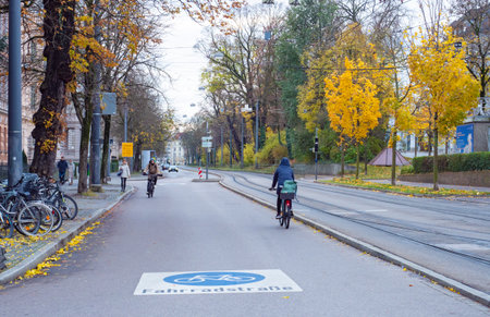 Augsburg, Germany - November 18th 2023: New cycling street and tr.amway in the inner cityのeditorial素材