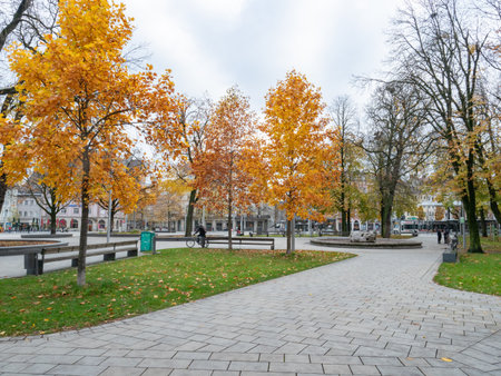 Augsburg, Germany - November 18th 2023: Attractive urban space with autumnal trees at Koenigsplatzのeditorial素材