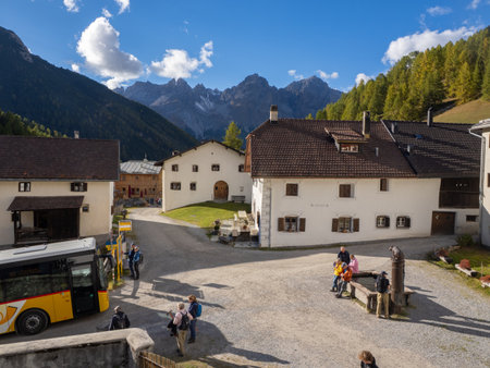 Scuol, Switzerland - October 9th 2025: Historic village square of S-charl surrounded by mountainous forests.のeditorial素材