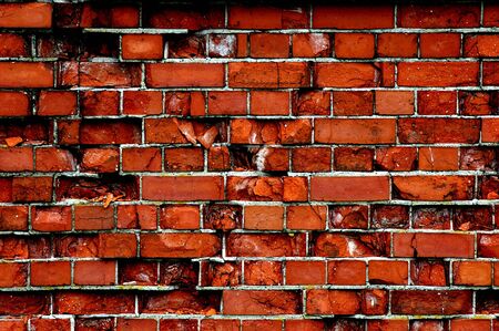 A brick wall background that has been well weathered from many years of neglect.