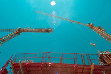 two cranes in the skyの写真素材