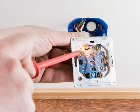 Person srewing a live cord causing a short circuit