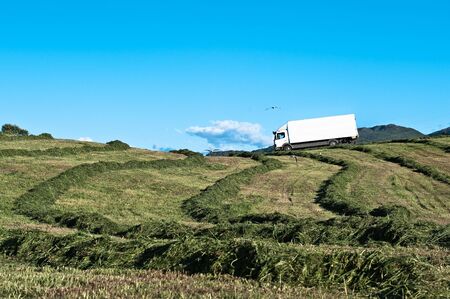 Lorry driving through a farm in Norwayの写真素材