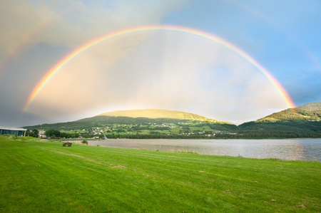 A rainbow over Voss city in Norwayの写真素材