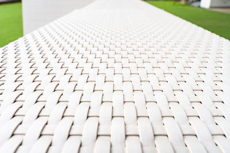 White sofa made with vimini in a gardenの写真素材