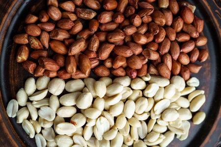 Raw peanuts in a clay bowl. Cajour and shelled beansの写真素材