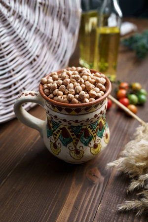 Raw chickpeas in earthenware bowlの写真素材