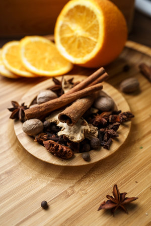 Spices for making mulled wine in a wooden bowlの写真素材