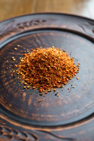 Mixture of spices on a clay plate. Spices and ingredients for cooking. Ingredients for cookingの写真素材