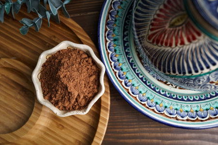 Cocoa powder in a clay bowl. Ingredients and spices for cookingの写真素材