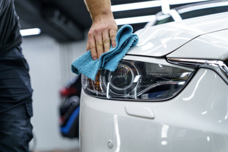 Man wipes a car with a ragの写真素材