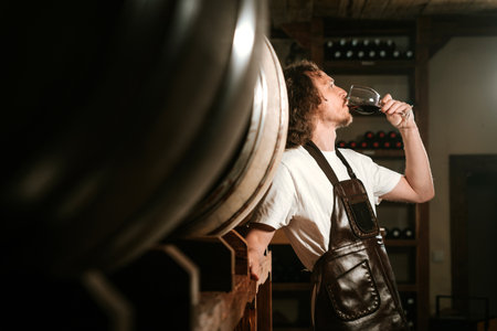 Tasting Red Wine for Quality in Cellarの写真素材