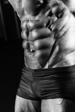 Athlete shows abdominal muscles