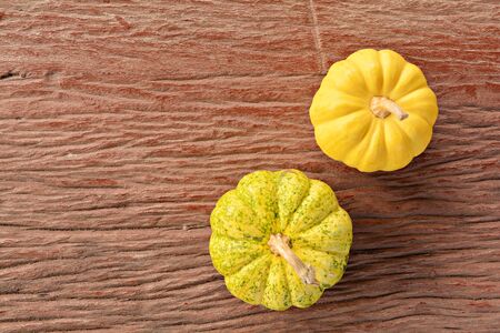 Fancy pumpkin on old wood texture background.の写真素材