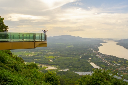 The lady holds her hands over her head in a beautiful and clean atmosphere./View on SkyWay in Thailandのeditorial素材