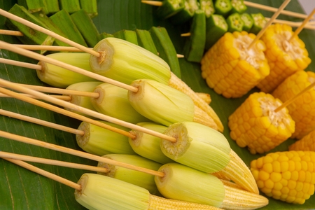 Baby corn and yellow corn cut into pieces. Prepare fire (Thai food)の写真素材
