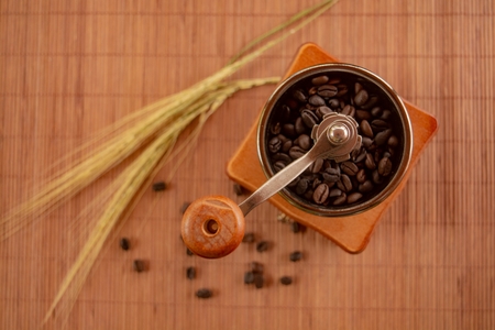 Rotary Coffee Grinder on bamboo blindの写真素材