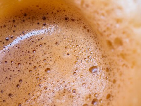 beige frothy coffee background textureの写真素材