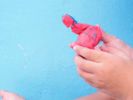 closeup of child play modeling clayの写真素材