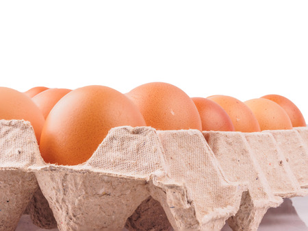 brown chicken eggs in carton.