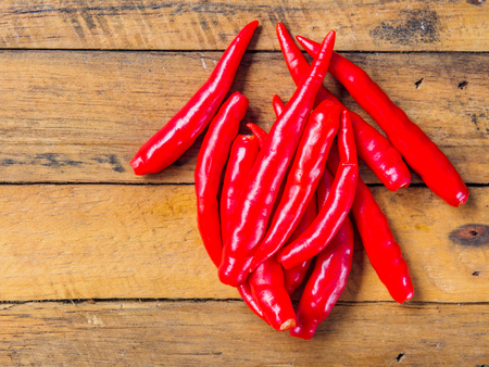 chilli on wood backgroundの写真素材