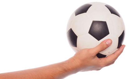 male hand holding football isolated on white background with clipping path.の写真素材