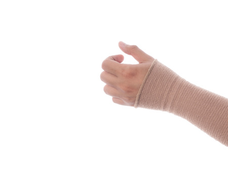 male hand wearing bandage arm from pain.の写真素材