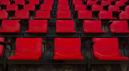 empty red stadium seatsの写真素材