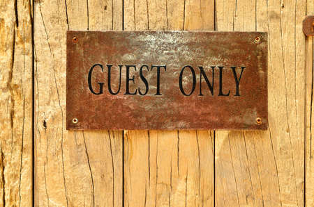 Grungy and brown wooden and text guest onlyの写真素材