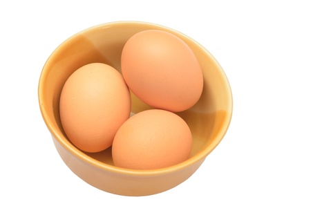 Eggs in a cup isolated on a white backgroundの写真素材