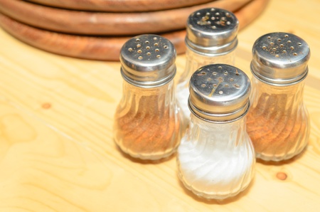 Pizza or pasta seasonings on a wood table の写真素材