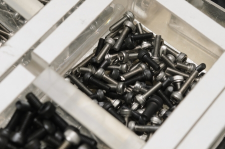 Box with many screws close up