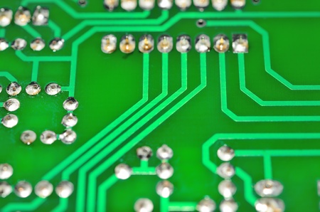 Detail of an electronic printed circuit board with many electrical components