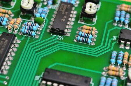 Detail of an electronic printed circuit board with many electrical componentsの写真素材