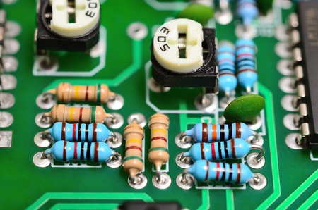 Detail of an electronic printed circuit board with many electrical components