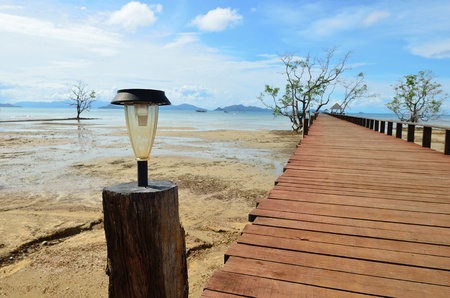 Ecology, solar lamp on wood bridgeの写真素材