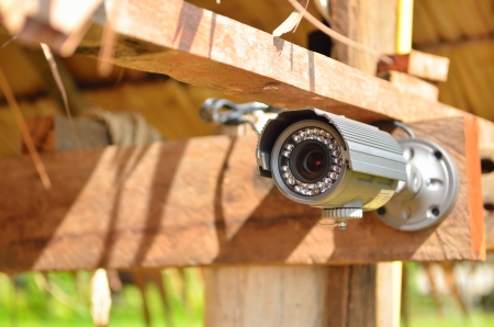 Security camera on the wood wallの写真素材