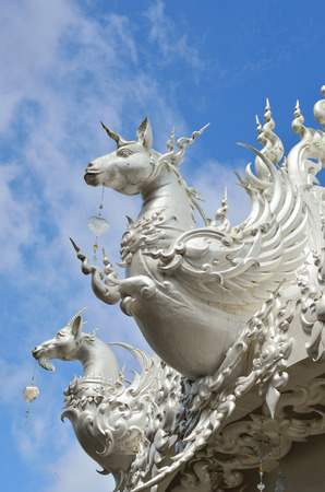 CHIANG RAI, THAILAND - NOVEMBER 21 : Wat Rong Khun buildings and sculptures  on Nov 21, 2013 in Chiang Rai, Thailand.  Buildings and sculptures of religion-based characters by contemporary craftsman of great skill.のeditorial素材
