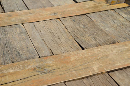 Grungy and brown wooden textured backgroundの写真素材