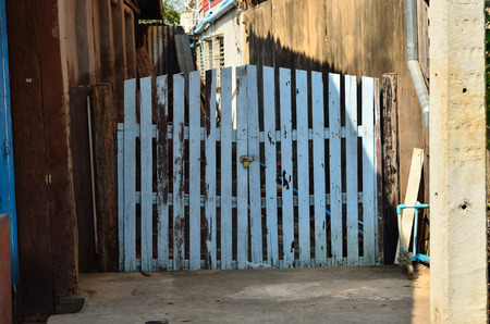 Locked old wooden door made from planksの写真素材