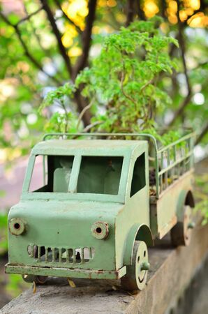 handmade steel green car and small plantの写真素材