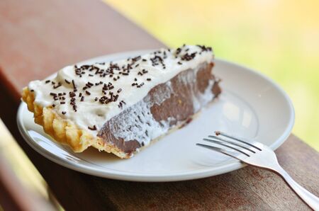 Piece of cake on wooden table